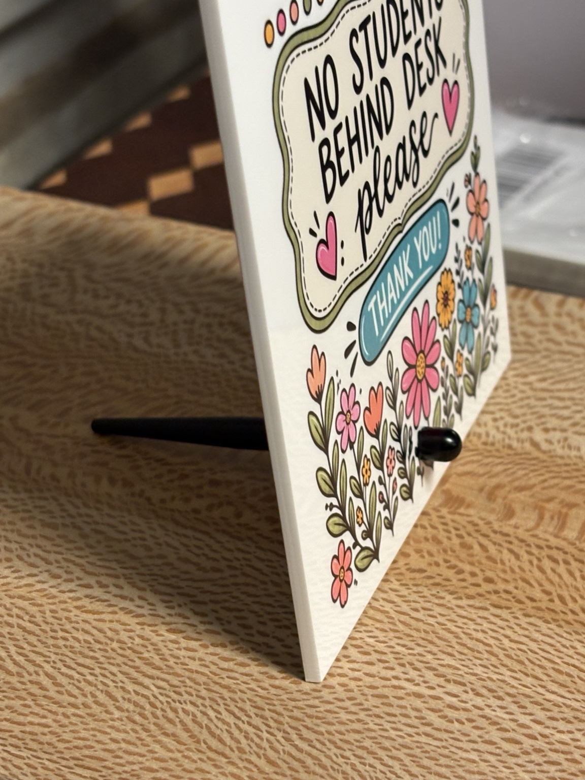 Custom acrylic sign side view showing stand