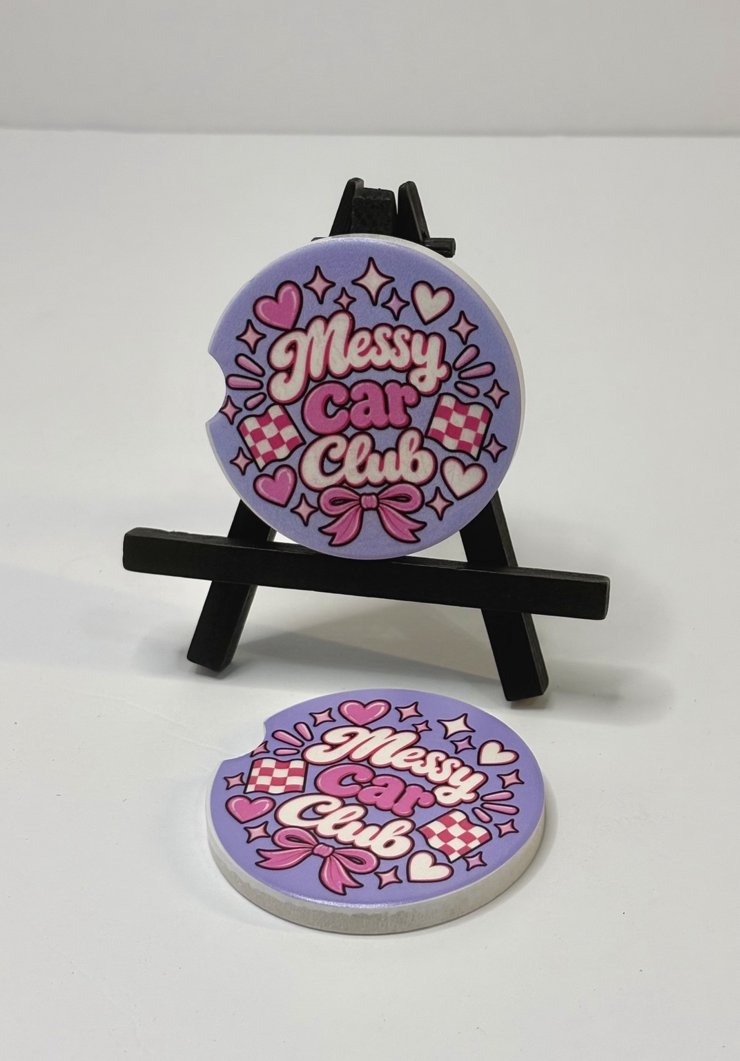 Messy Car Club car coaster displayed on a small easel